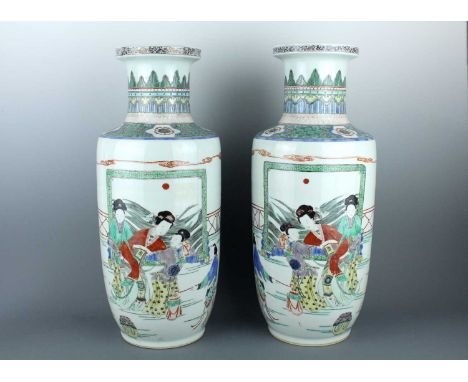 A pair of Chinese famille verte ‘ladies’ rouleau vases, in Kangxi style but 20th century. Of tall cylindrical form with sligh