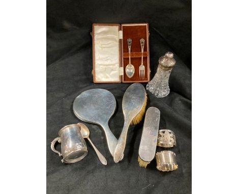 Silver dressing table set, 2 napkin rings, small tankard, fork 2 spoons and spray bottle.