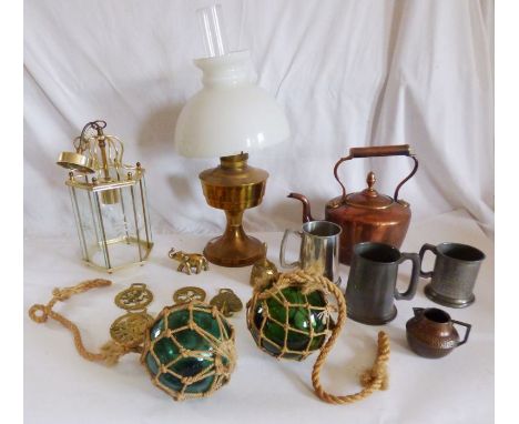 A collection of brass items to include a kettle, a Victorian&nbsp;glass lamp, horse brasses, some pewter tankards and 2 large