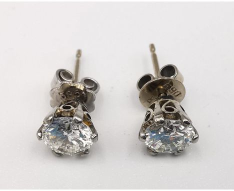 A pair of vintage 14ct white gold and diamond stud earrings, each earring set with a round brilliant cut diamond, ,I colour, 