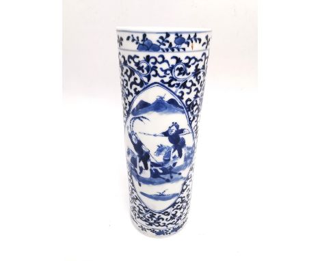 A 20th century Chinese blue and white cylindrical porcelain vase with two panels with warriors on horseback on a stylised scr