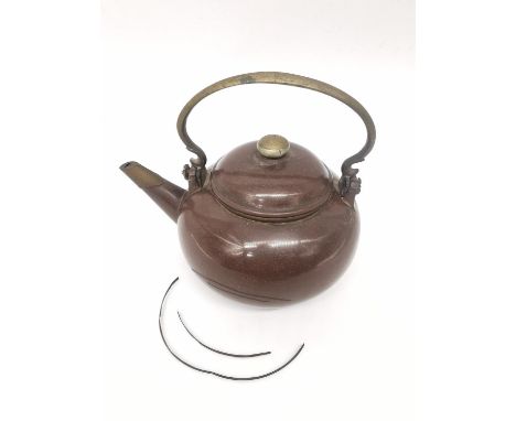 A Qing period Chinese polished Yixing clay teapot of rounded form with a brass scroll handle, the spout and cover with brass 