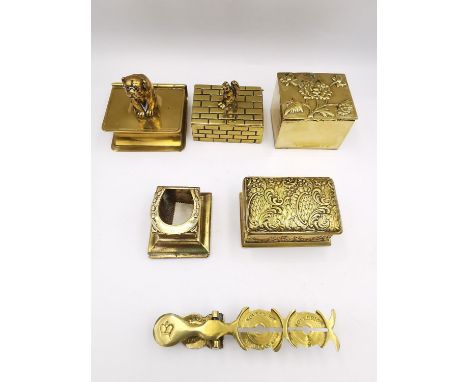 A collection of five 19th and early 20th century brass stamp boxes and a sovereign scale. The boxes include a one in the form