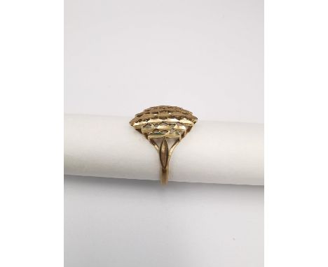 An abstract pierced design 9ct yellow gold dress ring. Hallmarked:375, Birmingham. Weight 1.90g Ring size P 1/2. 