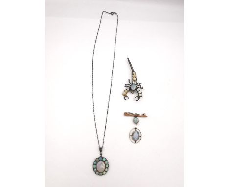 A collection of opal jewellery, including a black opal and white metal cluster pendant and chain, set with thirteen cabochon 