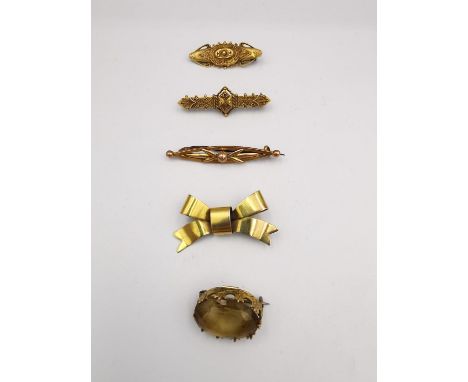 A collection of Victorian gold and yellow metal brooches, including two 15ct Etruscan revival bar brooches with beaded and wi