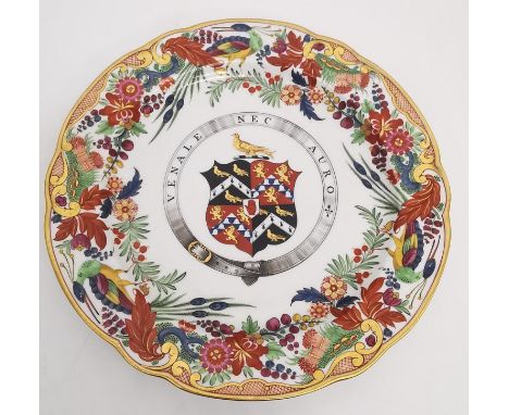 A 19th century Flight and Barr Worcester armorial ceramic plate, the ornate polychrome and gilt border with exotic birds, flo