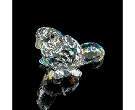 A clear faceted body with frosted teeth and black eyes. Swarovski mark. This item has its original box: 3.25"W x 2.5"H. Artis