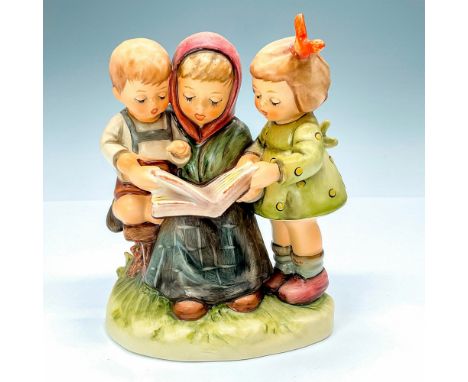 Goebel Hummel #458 Storybook Time figure, featuring a mother reading to her two young children. This is a First Issue from 19