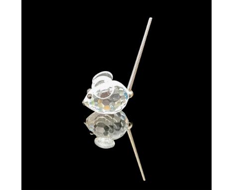 This charming mouse figurine boasts a faceted clear crystal body, capturing the light beautifully, along with a delightful sp