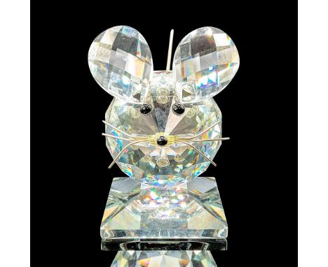 This cheerful mouse is made of brilliant clear crystal with expressive black eyes and with a silver metal tail and lively whi
