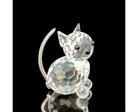 This crystal mini cat figurine is crafted from clear faceted crystal, with captivating black eyes and nose, and a charming fl