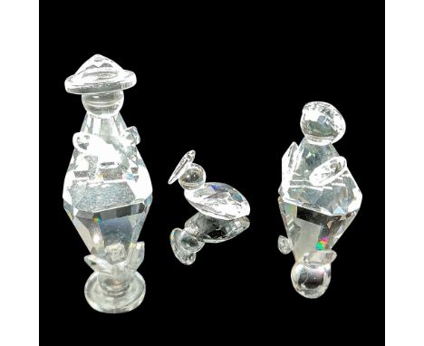 These three freestanding ornaments, part of the Nativity scene, are crafted entirely from brilliant, faceted crystal, adding 