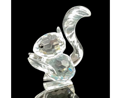 This squirrel figurine, part of the Rare Encounters group, showcases a clear faceted body and a clear crystal acorn, capturin