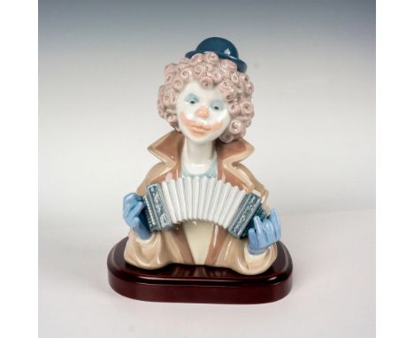 Glossy finish modeled as the bust of a clown playing the accordion. Lladro backstamp. This item has its original box. Box mea