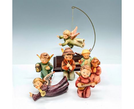 Beautifully made porcelain figures of angels and a boy playing a horn. Part of the Goebel Nativity. Goebel W. Germany backsta