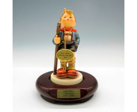 Hand painted figural of boy going hiking. Hummel Goebel tag - Final Issue 2002. Goebel backstamp. This item has a base includ
