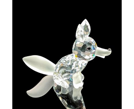 This fox figure showcases a clear faceted head and body, enhanced by a black nose and eyes, capturing the essence of this ele