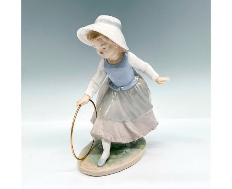 Glossy Nao Figurine Girl with Hoop from the Youth &amp; Childhood collection sculpted by Vicente Martinez. Porcelain figurine