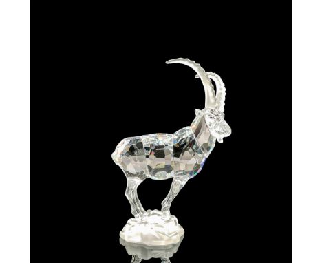 Part of the ""Endangered Species" theme. A clear faceted body with black eyes and frosted horns. Attached to a frosted base. 