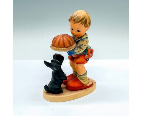 Hand painted figure of a young boy holding food away from the Scottie. Goebel Hummel marking. Issued: c. 1979-1990Dimensions: