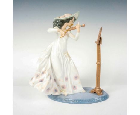 A glazed figure of a woman playing the violin. Lladro backstamp. Artist: Regino TorrijosIssued: c. 1996-2004Dimensions: 8.75"