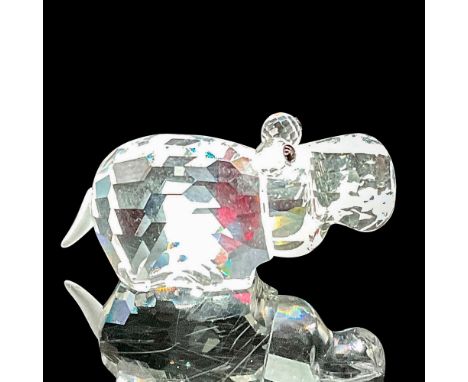 Crafted from clear crystal, this hippo figurine showcases small black eyes and a frosted crystal tail, capturing the charm an