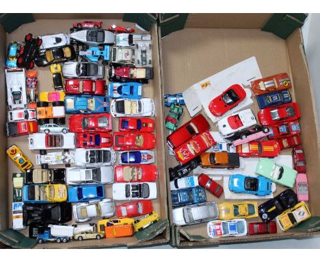 Two trays containing a quantity of mixed modern release diecasts to include a Bburago Majorette, Vintage Hotwheels, Corgi Roc