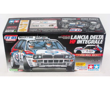 A Tamiya model No. 58342 1/10 scale radio controlled kit for a Lancia Delta HF Integral race car, appears as issued in the or