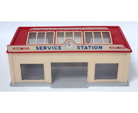 A Dinky Toys No. 785 Service Station kit, kit built example missing red doors otherwise complete, minor damage to roof sign