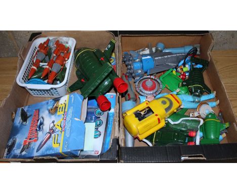 Two trays containing a quantity of Thunderbirds related action figures, vehicles and accessories, mixed examples to include T