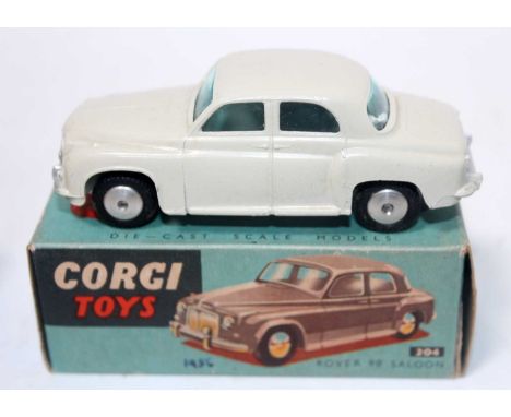 A Corgi Toys No. 204 Rover 90 saloon comprising of light grey body with spun hubs and windows housed in the original blue gro