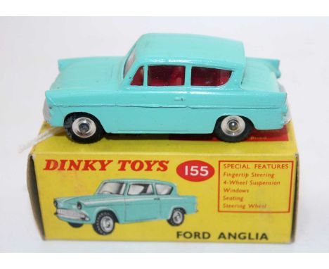 A Dinky Toys No. 155 Ford Anglia comprising turquoise body with red interior and spun hubs, housed in the original all-card b