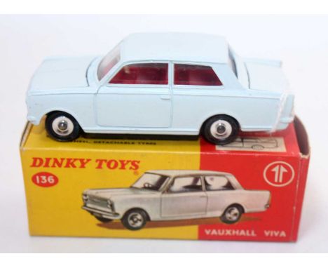 A Dinky Toys No. 136 Vauxhall Viva saloon comprising of white body with red interior and spun hubs complete with white plasti