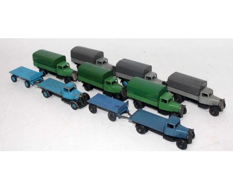 A Dinky Toys 25 Series wagon and covered wagon diecast group, eight examples, six fitted with canopies and the others without