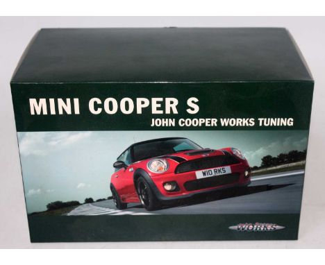A John Cooper Works 1/18 scale model of a Mini Cooper S diecast vehicle housed in the original polystyrene packed box, appear