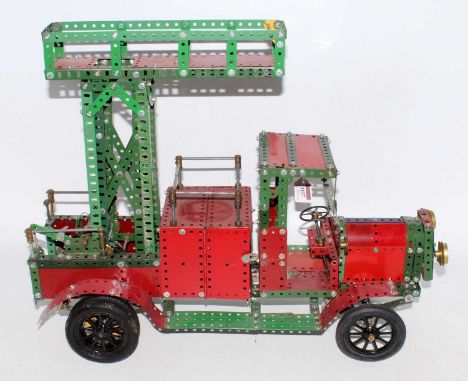 A Meccano home-built model of mainly 1950s red and green components, vintage tower wagon, with rise and fall action, length 6