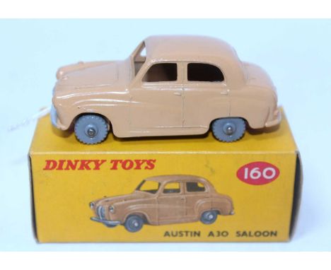 A Dinky Toys No. 160 Austin A30 saloon, comprising tan body with grey plastic wheels housed in the original colour spot all-c