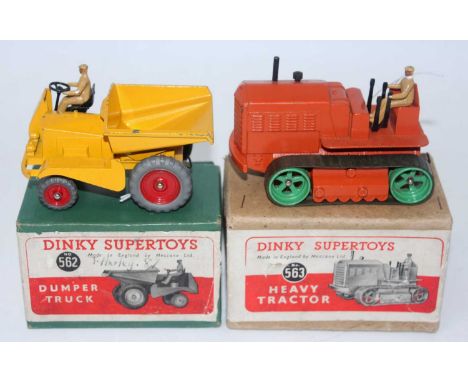 A Dinky Toys boxed construction vehicle diecast group to include a No. 563 heavy tractor finished in orange with green wheels