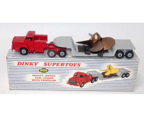 A Dinky Toys No. 986 Mighty Antar low loader with propeller, comprising of red tractor unit with grey low loader trailer and 