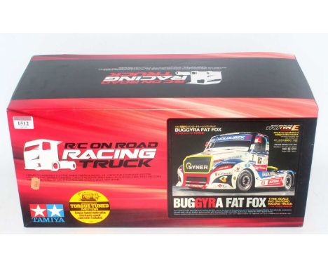 A Tamiya model No. 58661 1/14 scale radio controlled model of a Buggyra Fat Fox racing truck, appears unmade and housed in th