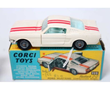 A Corgi Toys No. 325 Ford Mustang Fast Back 2+2 Competition Race Model comprising of white body with double red body racing s