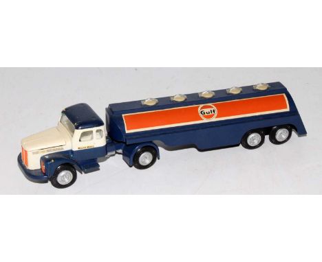 A Tekno Gulf Scania Vabis articulated tractor unit and trailer comprising of dark blue, white and orange body with Gulf liver