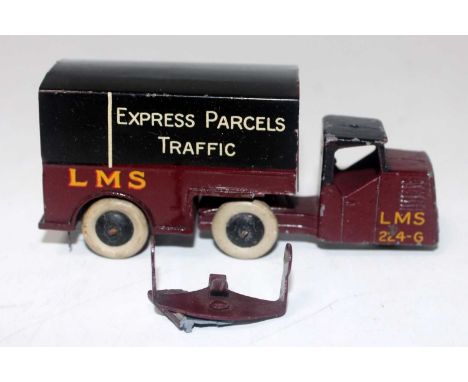 A Dinky Toys pre-war No. 33R LMS Express Parcels traffic mechanical horse and trailer (model requires restoration to rear tra