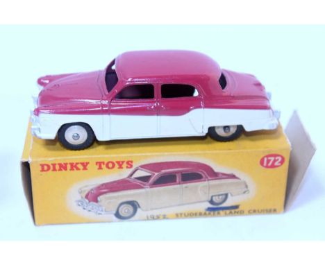 A Dinky Toys No. 172 Studebaker Land Cruiser comprising of cream low line body with cerise upper body complete with beige hub