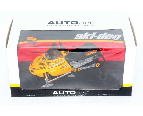 An Auto Art Contemporary series model No. 79811 1/12 scale model of a Ski-doo MXZ700 snowmobile, finished in yellow, housed i