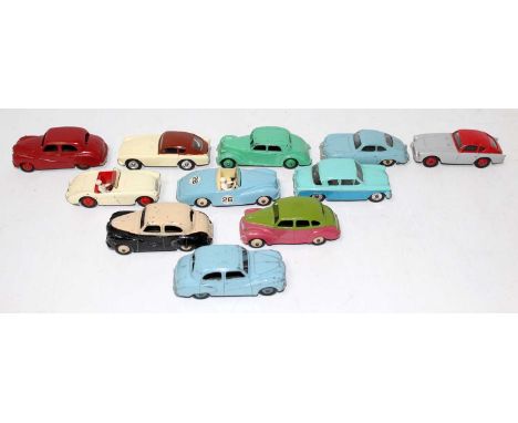 Eleven various loose Dinky toy playworn diecasts, various saloons to include an Austin Devon finished in pink and green with 