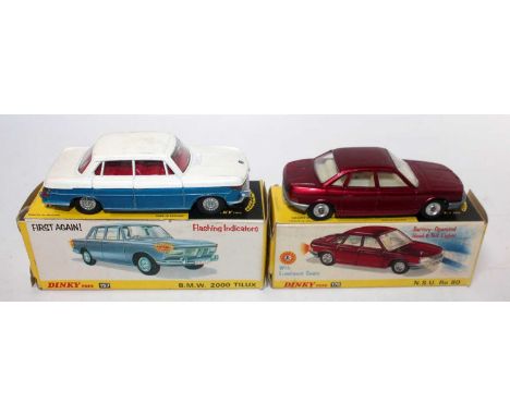 A Dinky Toys boxed saloon group to include a No. 157 BMW 2000 Tilux comprising of two tone white and metallic blue body with 