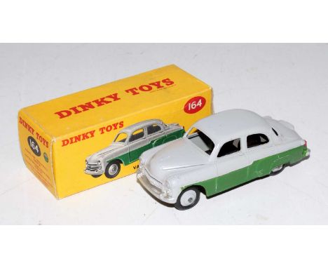 A Dinky Toys No. 164 Vauxhall Cresta saloon comprising of grey and green body with grey hubs housed in the original correct c