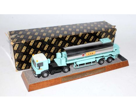 A 1/50 scale SCR diecast desk display model of a Volvo tractor unit with hazardous tanker trailer, model finished in light bl